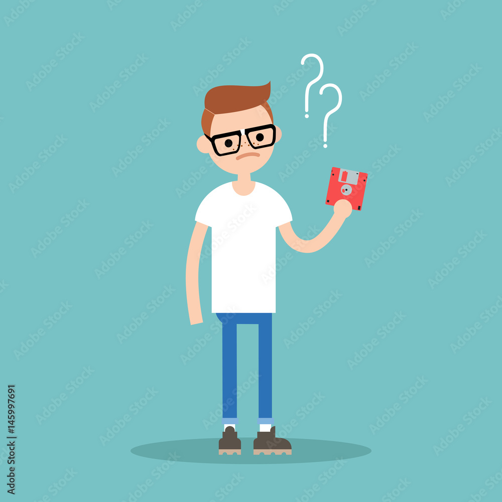 Outdated technology concept. Young geek has no idea what to do with the floppy disk / flat editable vector illustration Outdated technology concept. Young geek has no idea what to do with the floppy disk / flat editable vector illustration