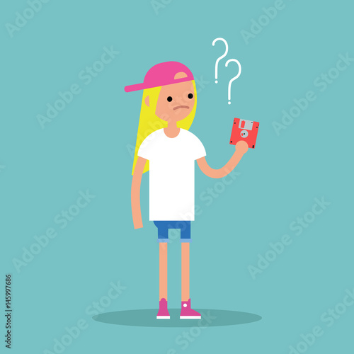 Outdated technology concept. Young blond girl has no idea what to do with the floppy disk / flat editable vector illustration