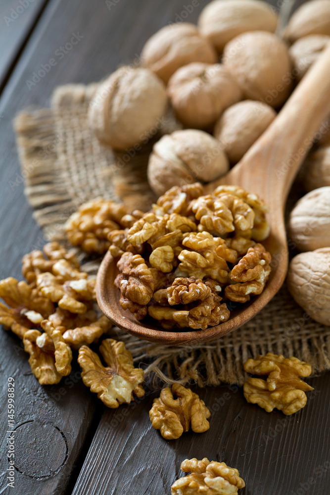 walnuts on wooden surface walnuts on wooden surface