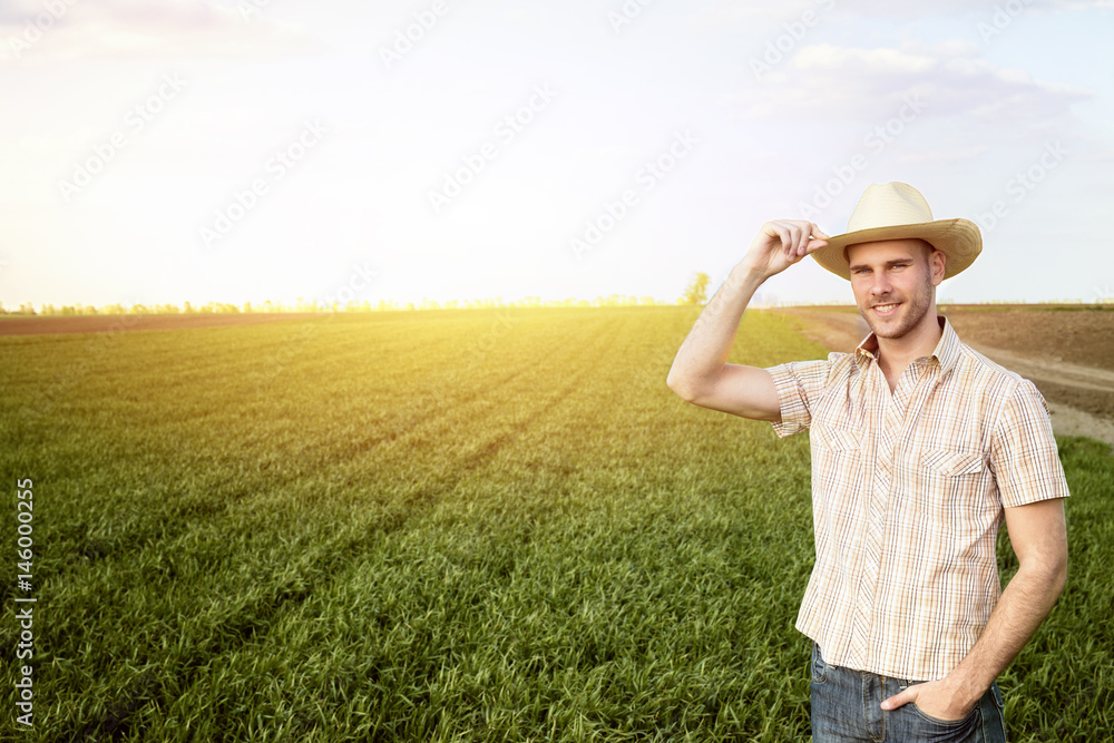 Happy farmer in the field. Agriculture.