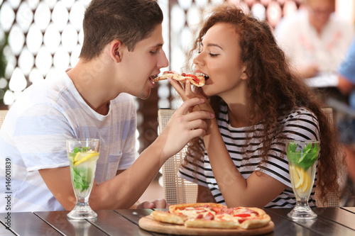 Lovely couple eating pizza