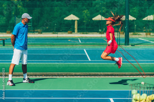Tennis girl jumping rope © Microgen