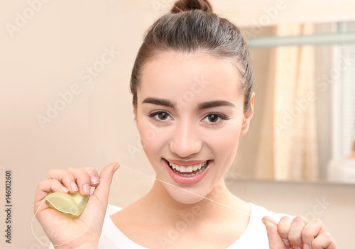 Beautiful woman brushing te...