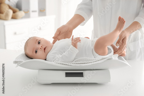 Female doctor weighting cut...