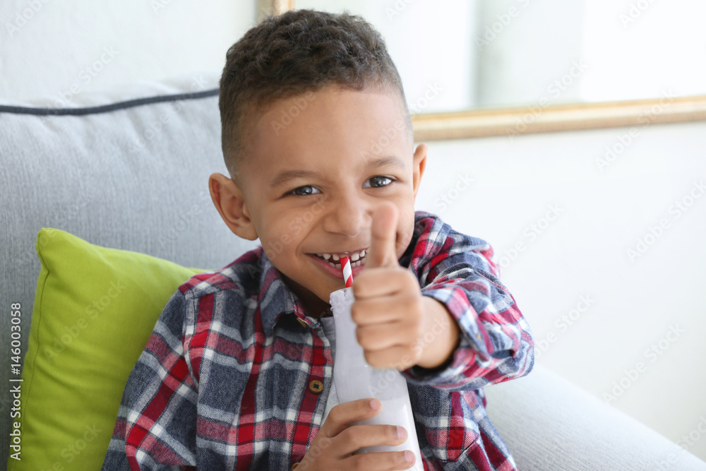 Cute African American boy drinking yogurt at home Stock Photo Adobe Stock