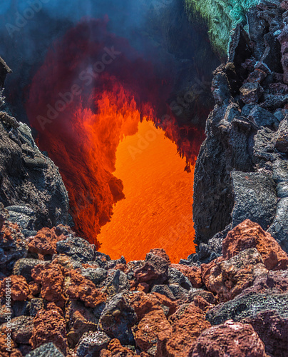 The boiling magma flows through lava tubes under a layer of cooled lava - volcano Tolbachik, Kamchatka, Russia photo