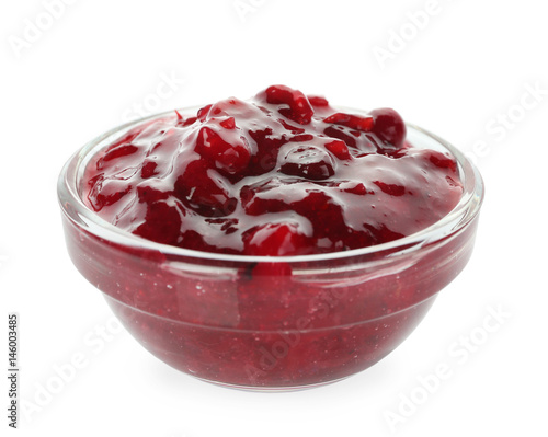 Delicious cranberry sauce in bowl on white background