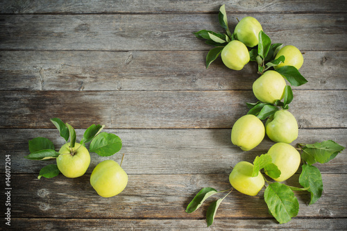green apples on wooden background