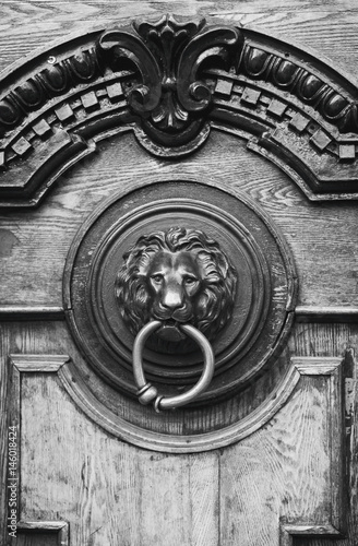 An ancient door handle with metal lion head in Tbilisi, Georgia