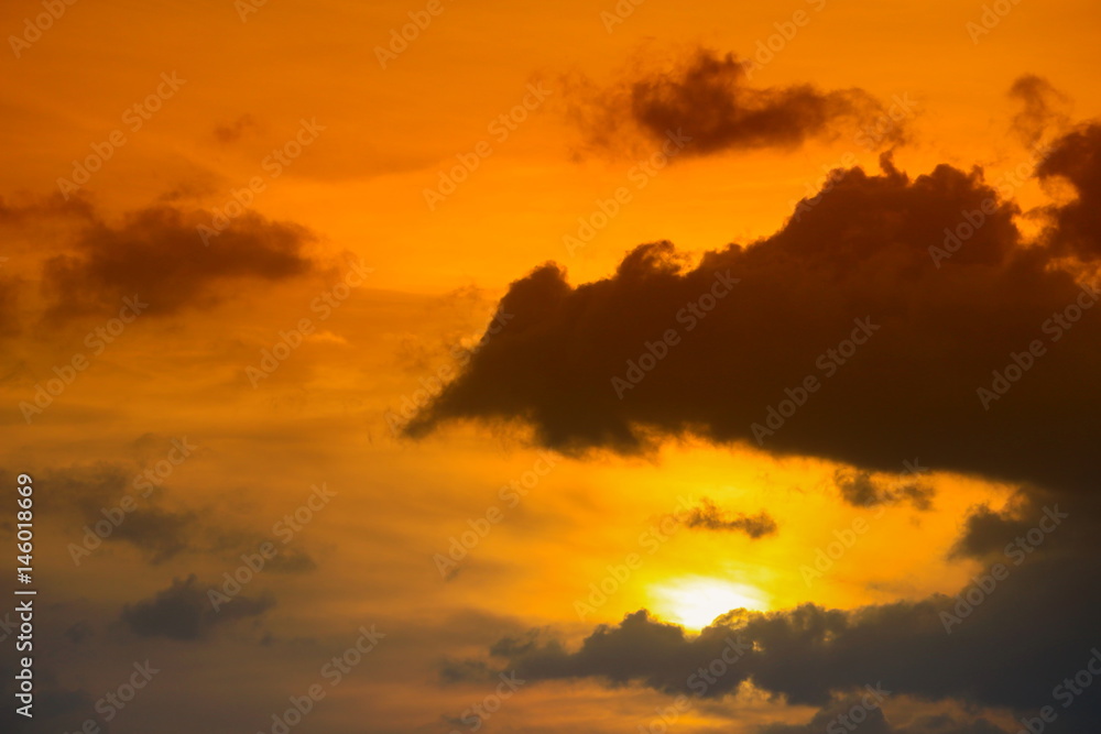 dramatic sunset and sunrise in the beautiful yellow cloud in a sky