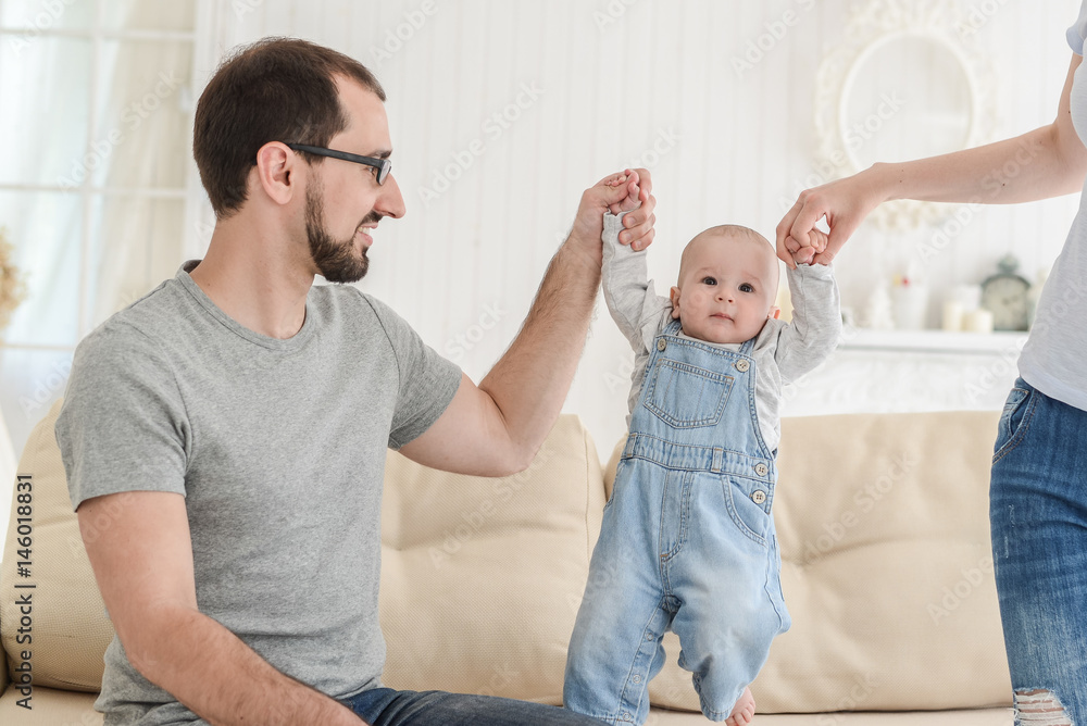 Fototapeta premium family with the baby in the room