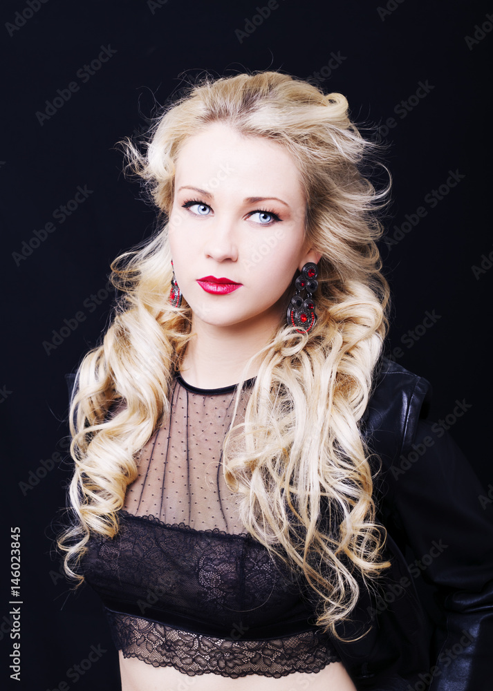 Beautiful fashion model girl with blond hair. Portrait of glamour woman with bright makeup isolated on black background. Beautiful fashion model girl with blond hair. Portrait of glamour woman with bright makeup isolated on black background.