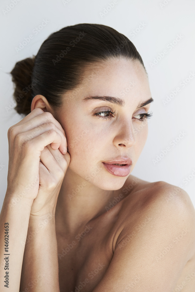 Contemplative beautiful brunette, looking away