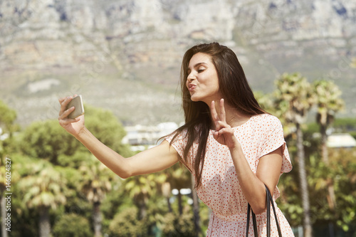 Pretty girl posing for self portrait, pouting photo