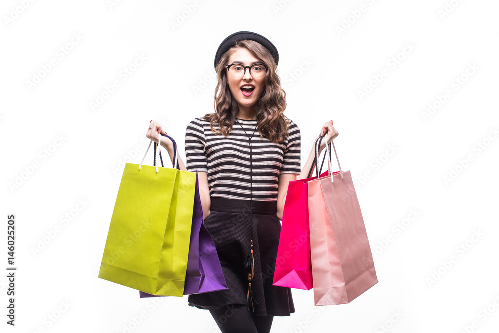 Portrait of young happy smiling woman with shopping bags on white Portrait of young happy smiling woman with shopping bags on white