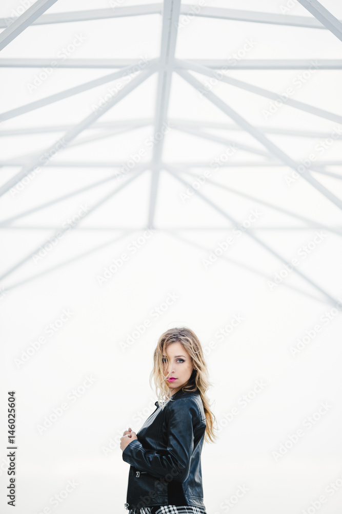 The beautiful girl stands in the center of room The beautiful girl stands in the center of room