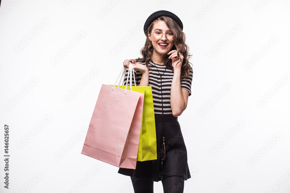 Shopping woman holding bags isolated on white studio background