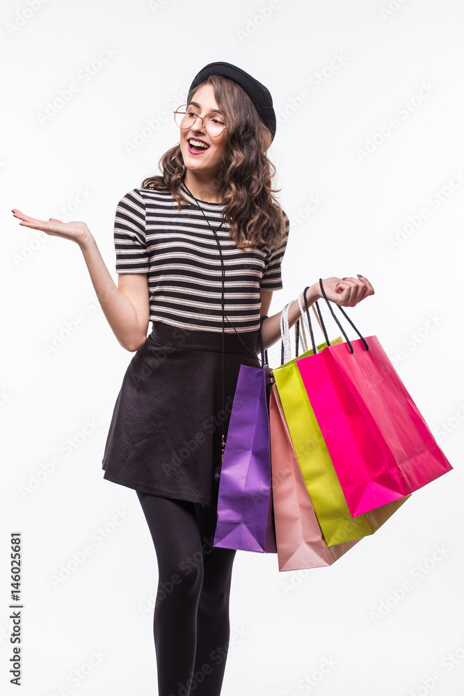 Very happy beautiful young woman in casual clothing with shopping bags, with copyspace for slogan or text message Very happy beautiful young woman in casual clothing with shopping bags, with copyspace for slogan or text message