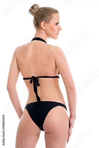 back view on Knitted swimsuit. Gorgeous Model wearing luxury swimwear.