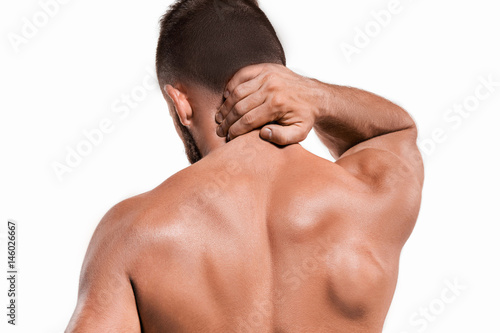 Studio shot of man with pain in neck