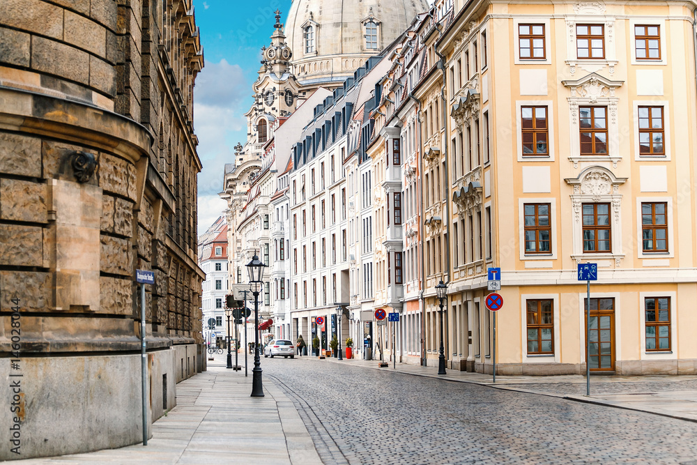 A narrow street in the historic center of Dresden in the morning without pedestrians and cars