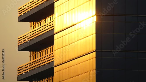 time lapse shot of beautiful sunset reflected on office building window