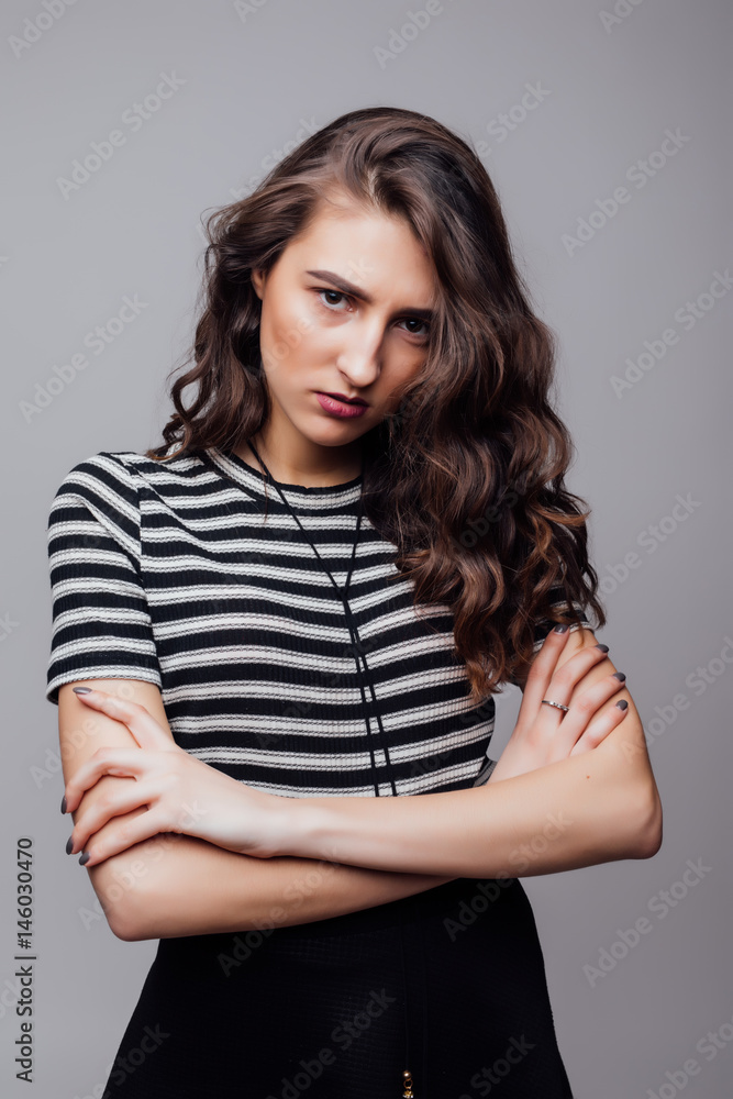 Fototapeta premium Fashion portrait pretty sweet young woman over grey background