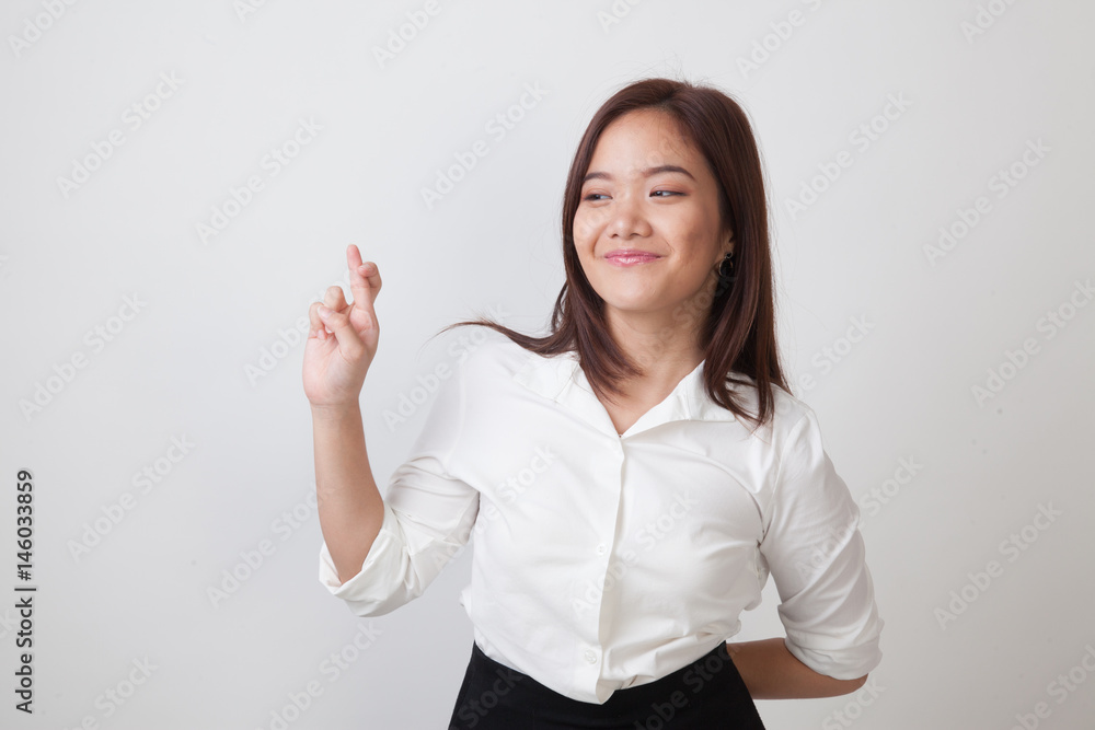 Beautiful young Asian woman cross finger. Beautiful young Asian woman cross finger.