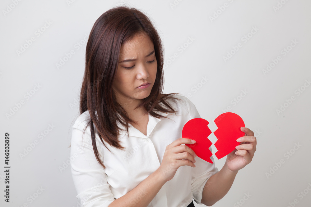 Beautiful young Asian woman with broken heart. Beautiful young Asian woman with broken heart.