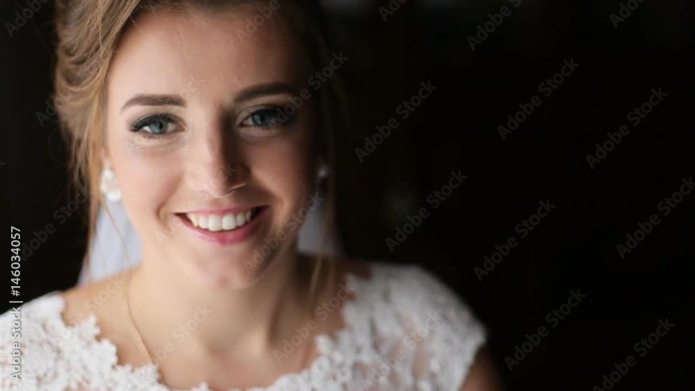 Portrait of beautiful bride smiling to the camera before wedding ceremony. Close up Portrait of beautiful bride smiling to the camera before wedding ceremony. Close up