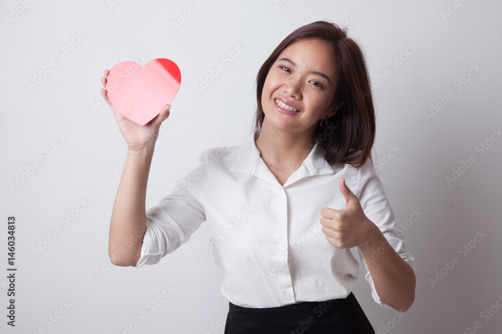 Asian woman thumbs up with red heart. Asian woman thumbs up with red heart.