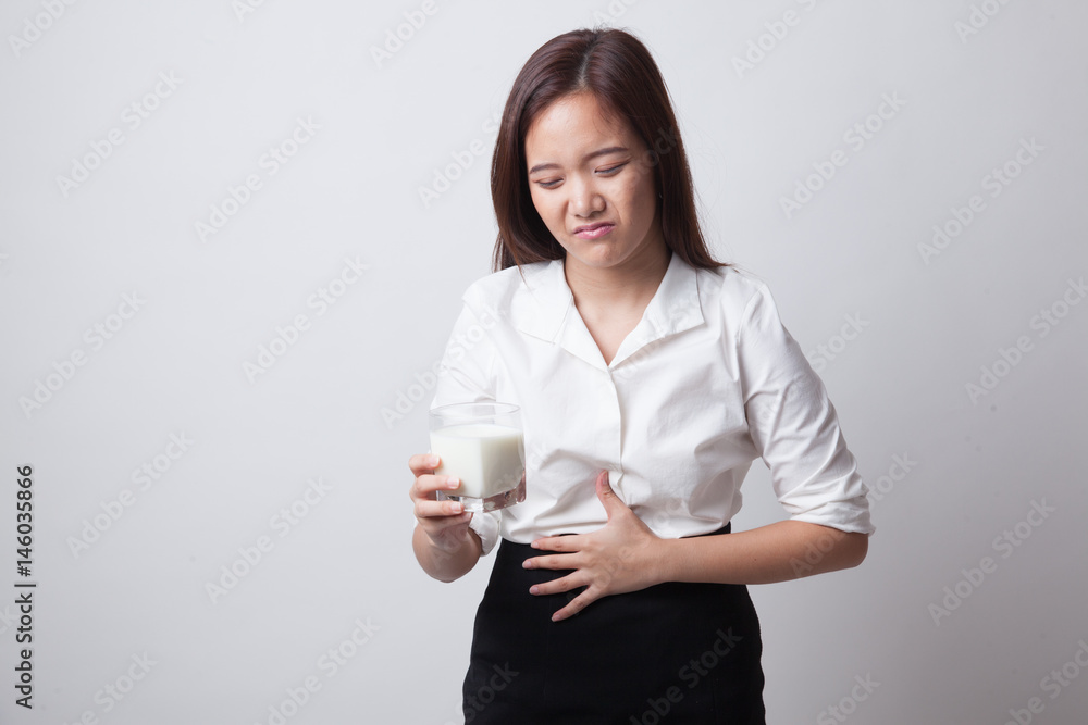 Asian woman drinking a glass of milk got stomachache. Asian woman drinking a glass of milk got stomachache.