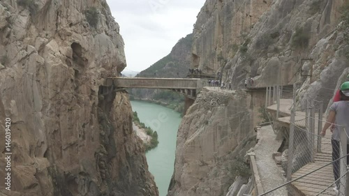 Walkers in 'El Caminito del Rey' with final bridge, route end