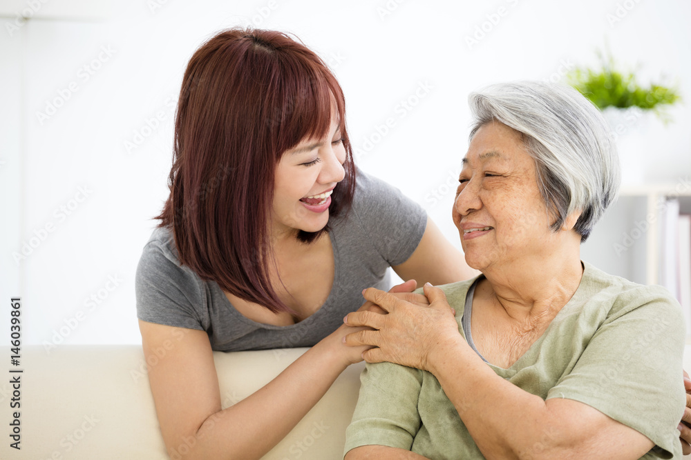 Grandmother and granddaughter. Young woman carefully takes care of old woman. Grandmother and granddaughter. Young woman carefully takes care of old woman.