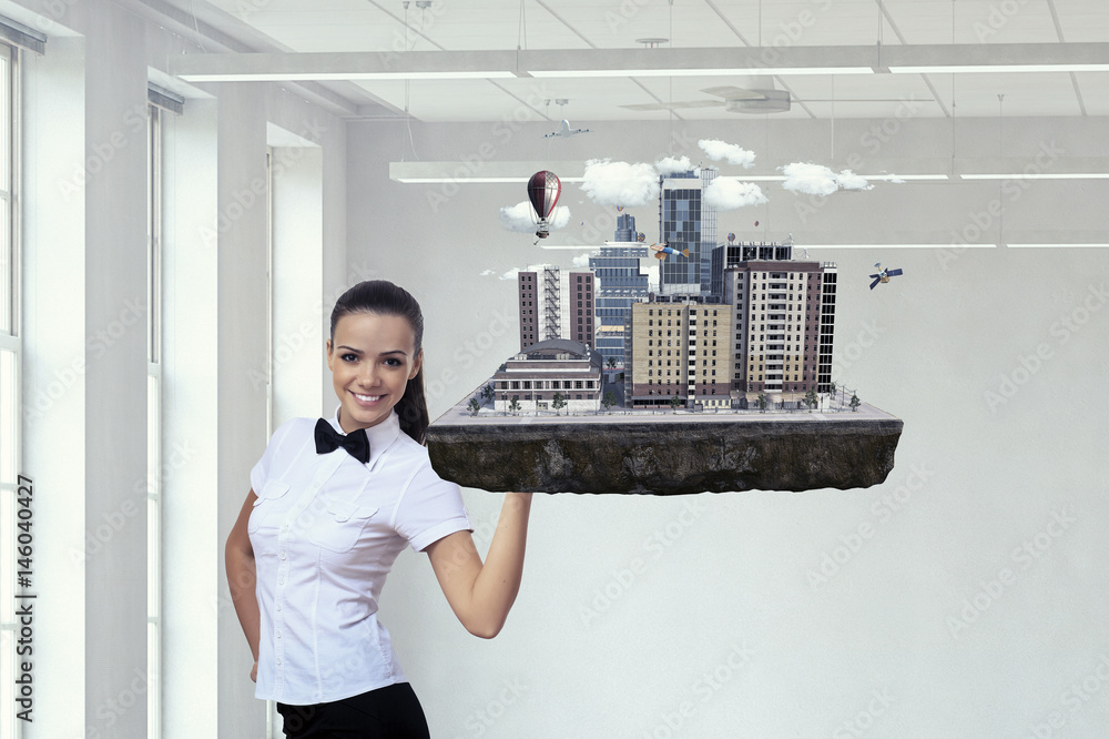 Obraz premium Woman presenting construction model. Mixed media