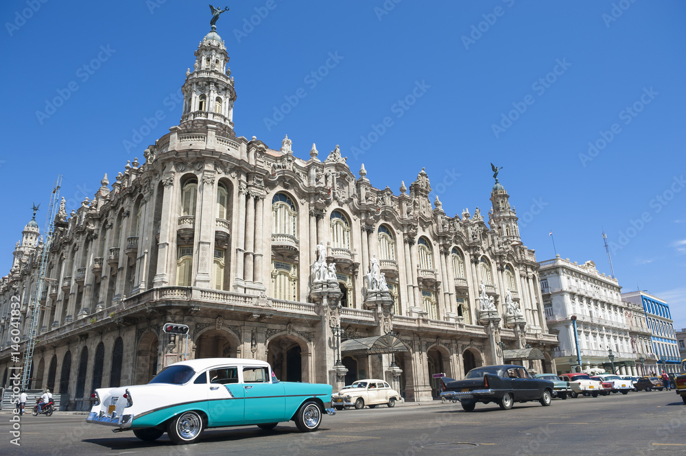 Scenic view of traffic passing in front of the wedding cake colonial architecture of central Havana, Cuba