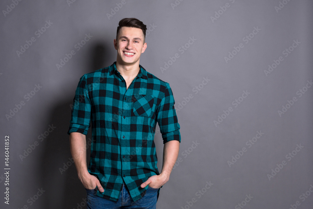 Obraz premium Young handsome man studio portrait, boy style
