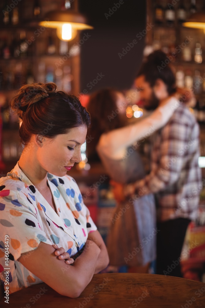 Obraz premium Upset woman ignoring affectionate couple