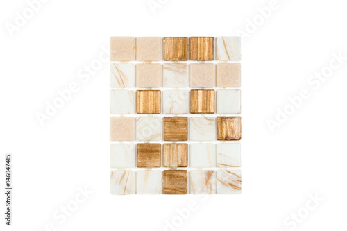 Fragment of a mosaic of small shiny tiles on white background