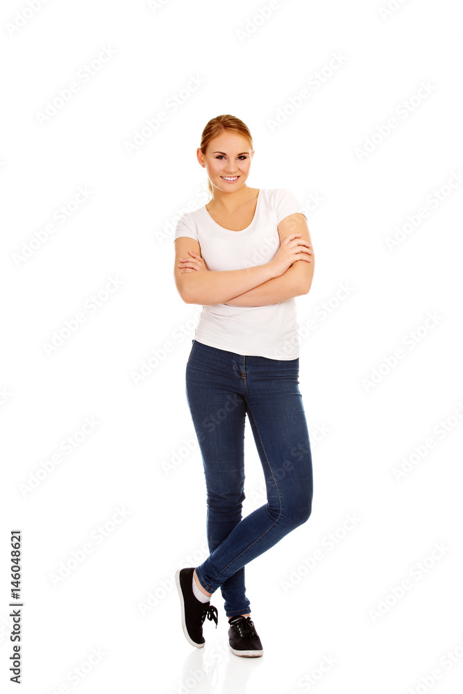 Fototapeta premium Happy young woman wiyh folded arms