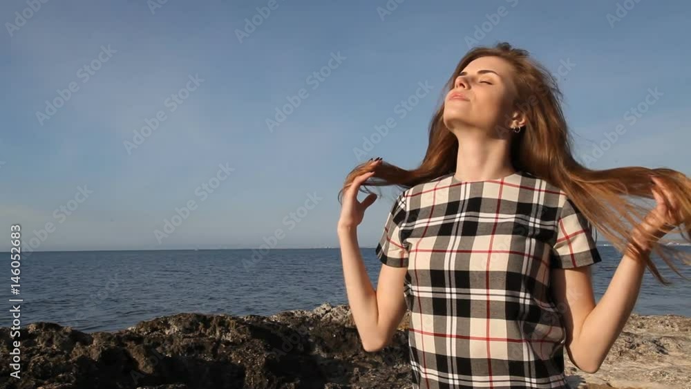 girl on beach rocks and stones sea girl on beach rocks and stones sea