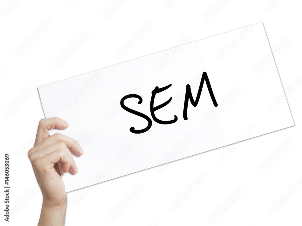 SEM (Search Engine Marketing) Sign on white paper. Man Hand Holding Paper with text. Isolated on white background SEM (Search Engine Marketing) Sign on white paper. Man Hand Holding Paper with text. Isolated on white background