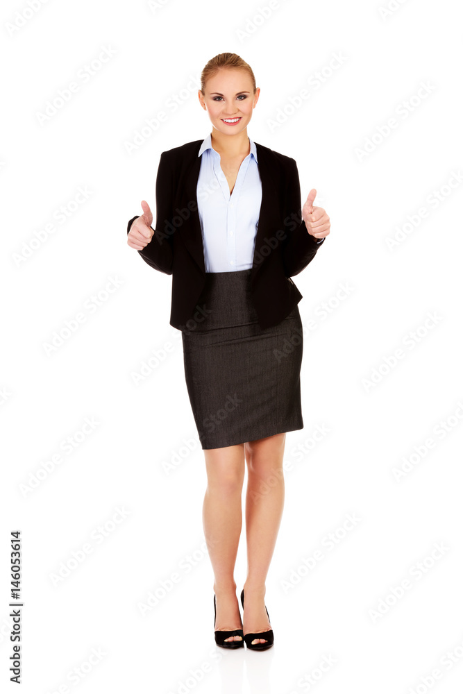 Young happy business woman with thumbs up Young happy business woman with thumbs up