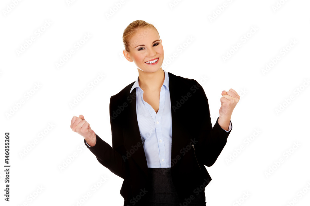 Young happy business woman with arms up Young happy business woman with arms up