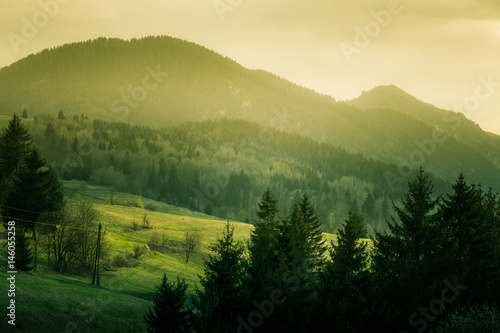 A beautiful hillside scenery of Tatra mountains. Warm summer haze, colorful contrast look.