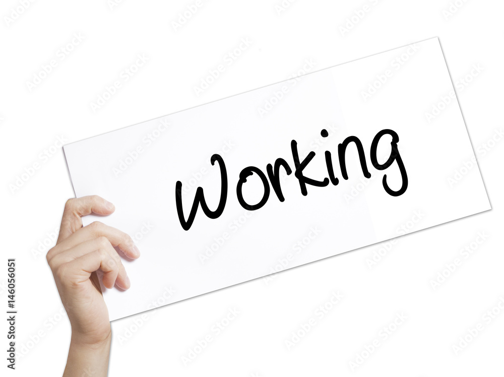 Working Sign on white paper. Man Hand Holding Paper with text. Isolated on white background Working Sign on white paper. Man Hand Holding Paper with text. Isolated on white background