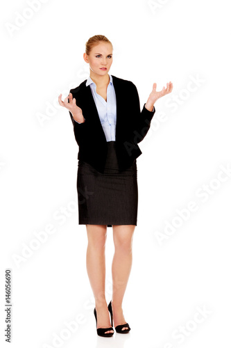 Angry business woman with hands up