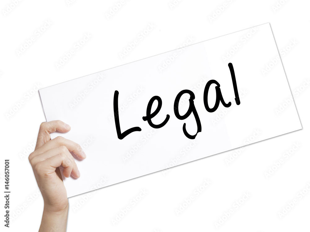Legal Sign on white paper. Man Hand Holding Paper with text. Isolated on white background Legal Sign on white paper. Man Hand Holding Paper with text. Isolated on white background