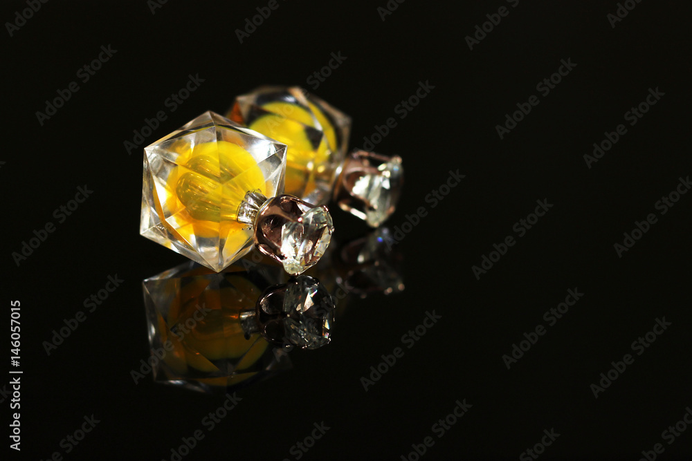 Beautiful earrings on a black background Beautiful earrings on a black background