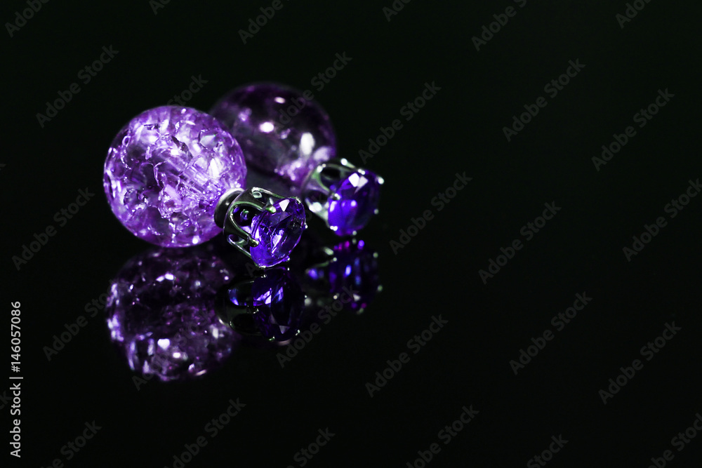 Beautiful earrings on a black background Beautiful earrings on a black background